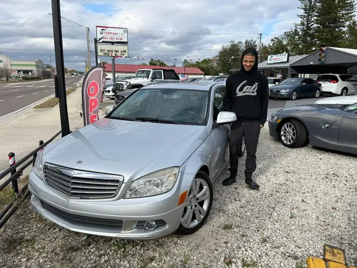 Customer next to their Mercedes-Benz C-Class